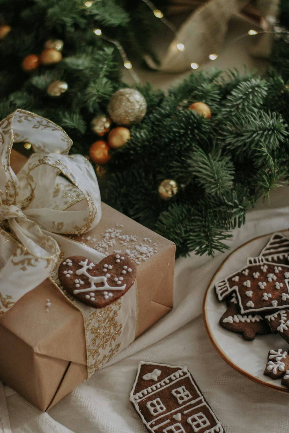 a box of cookies next to a plate of cookies