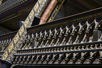 Detailed image of a decorative metal railing crafted with artistic curves and patterns.
