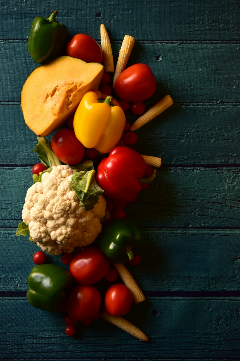 a number of different types of vegetables on a table