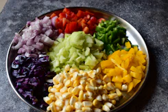 a plate of chopped vegetables on a table