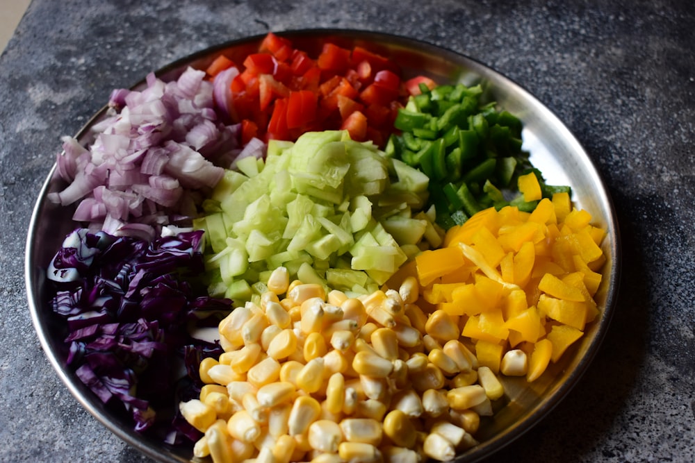 a plate of chopped vegetables on a table