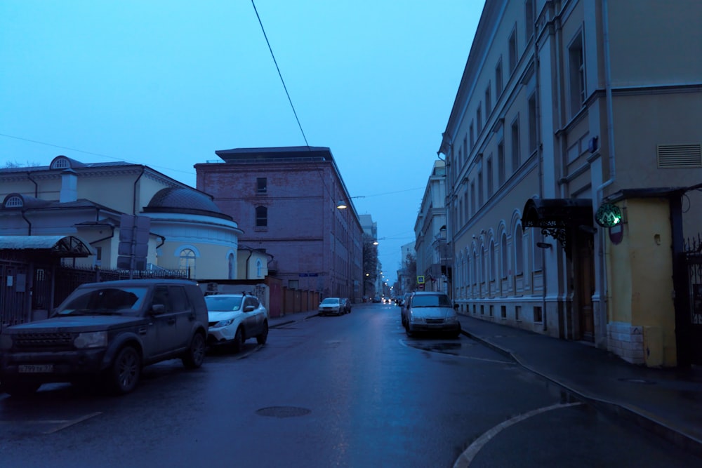 a street with cars parked on the side of it