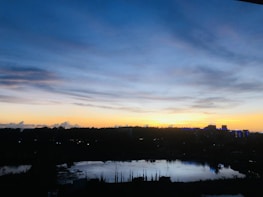 A serene Zurich cityscape blending with Moroccan desert hues at sunset, symbolizing cultural fusion.