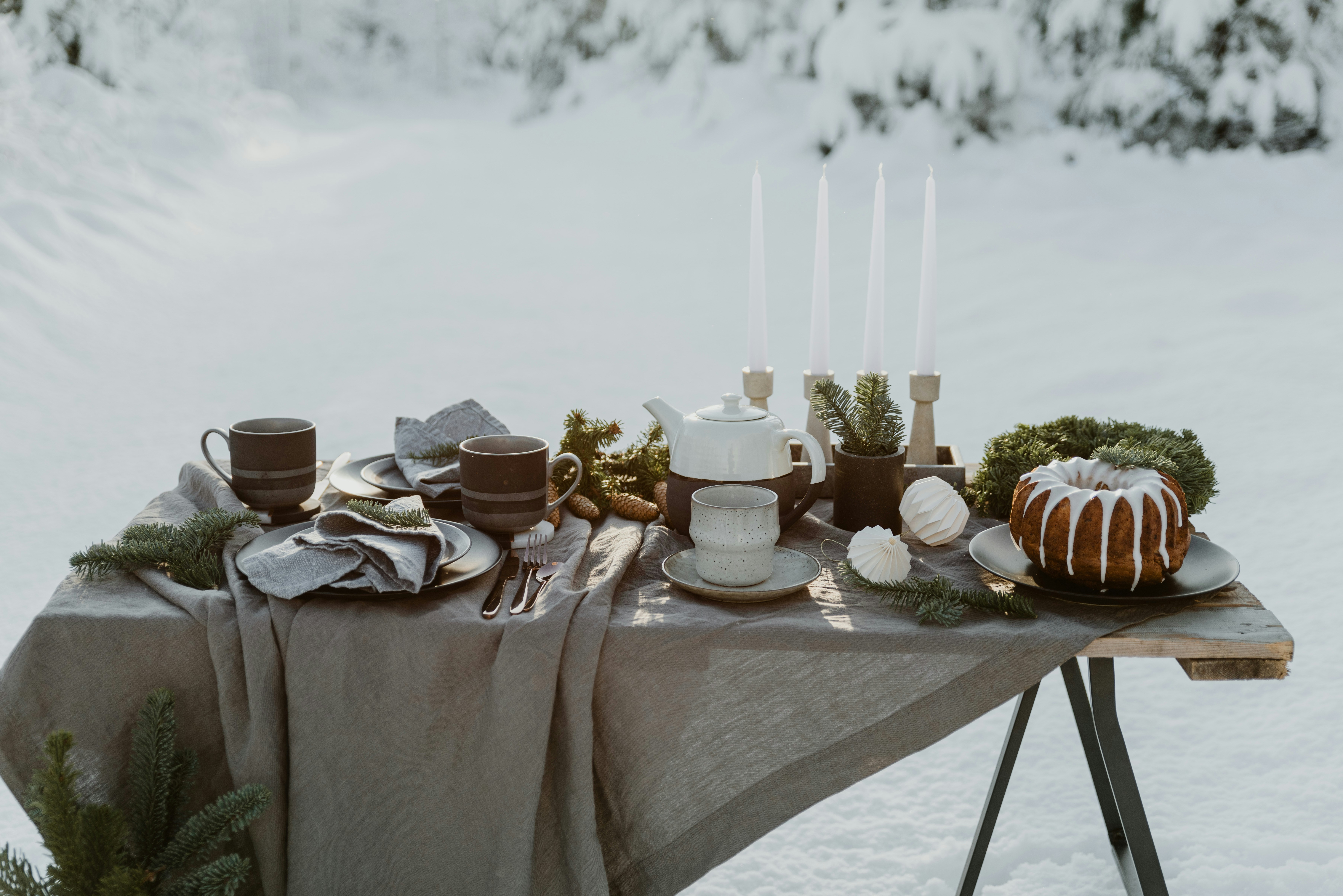 a table topped with a cake covered in frosting