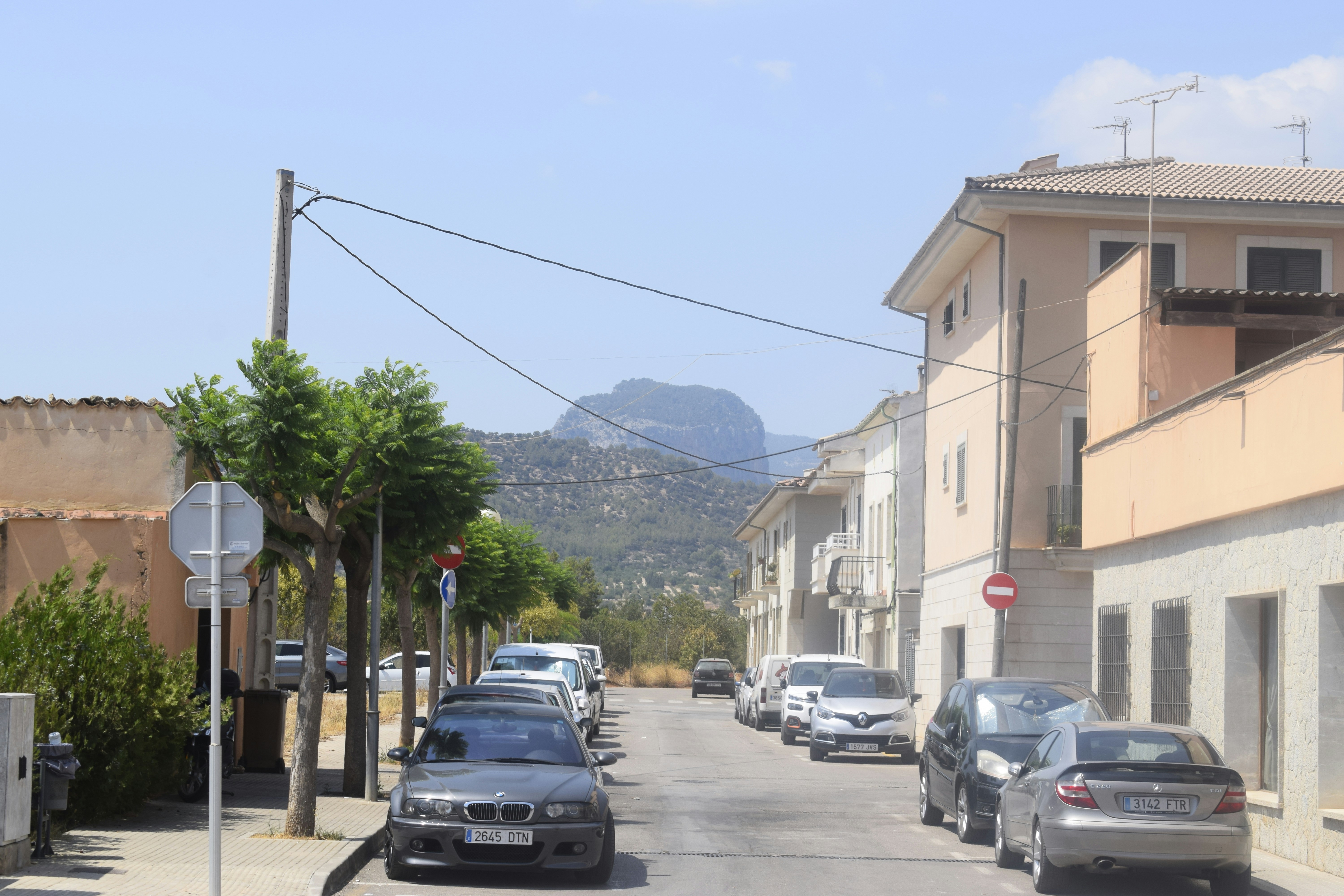 cars are parked on the side of the road
