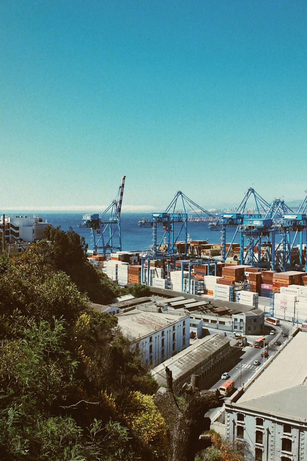 a view of a harbor with a crane in the background