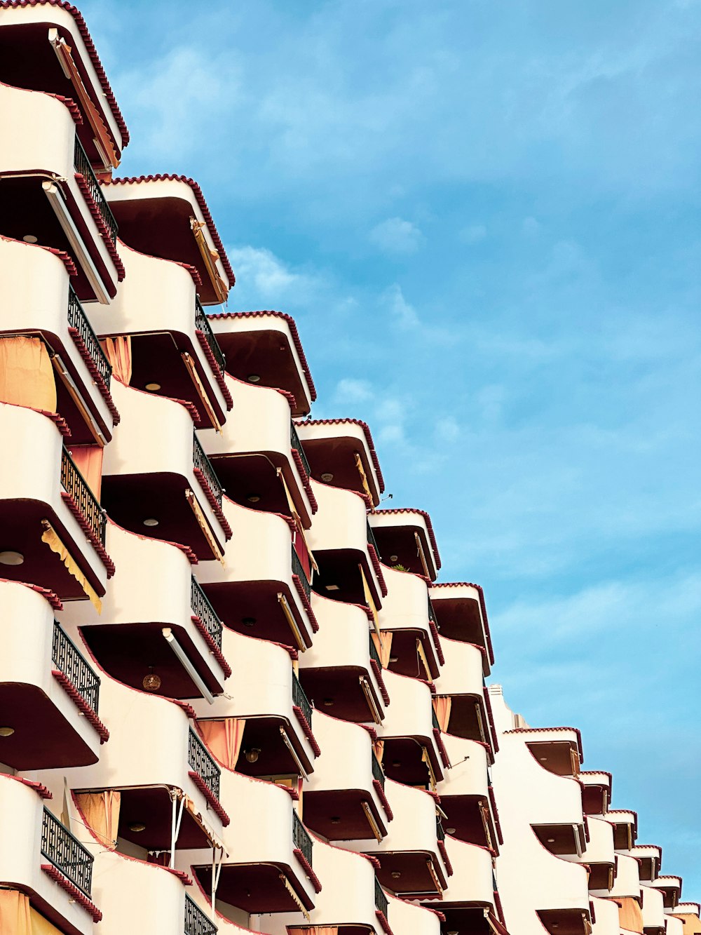 a tall building with balconies and balconies on it