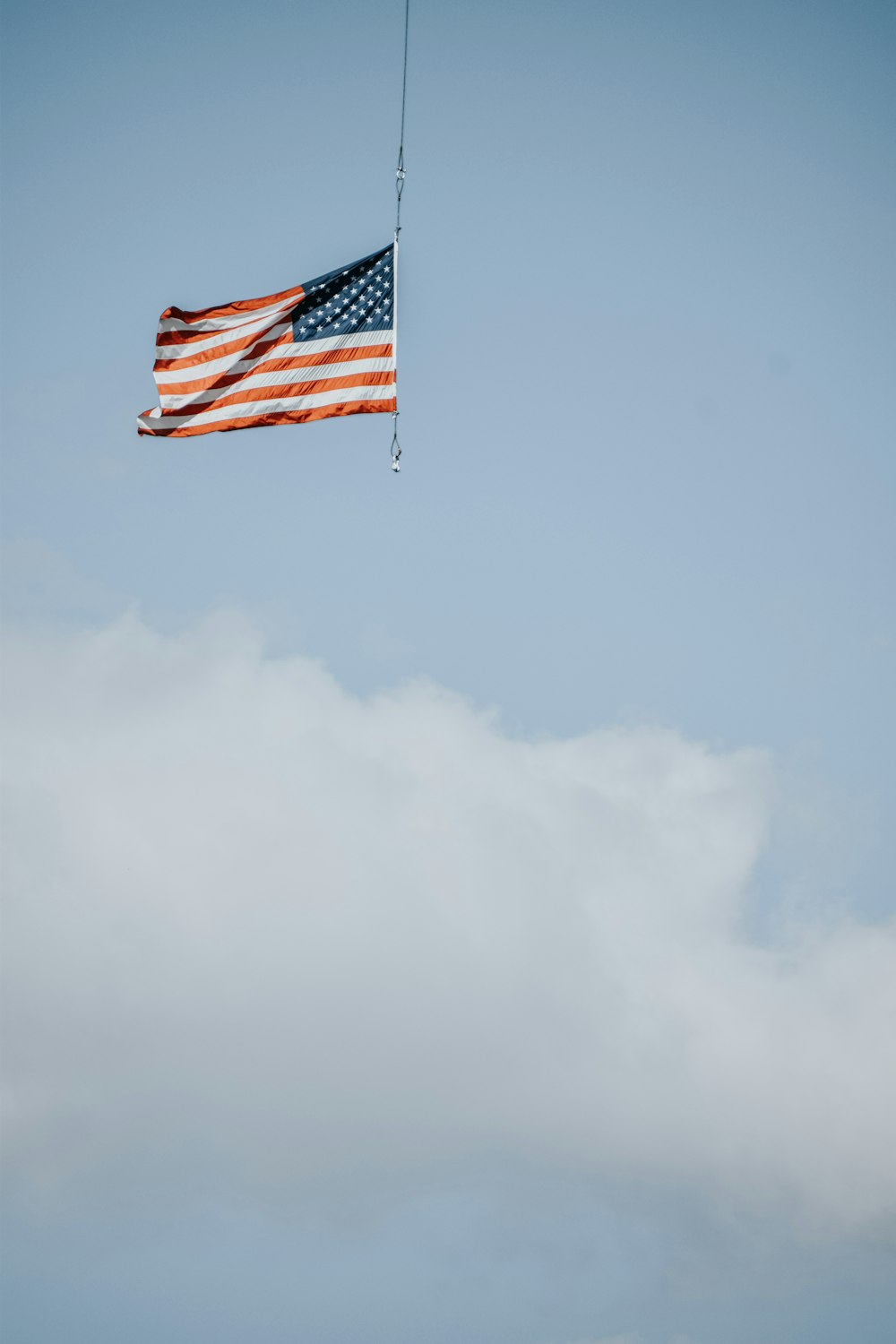 an american flag is flying in the sky