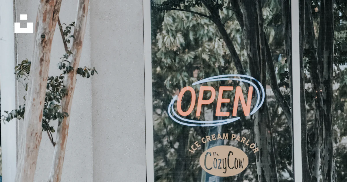 An open sign in a window of a building photo – Free Huntsville Image on ...
