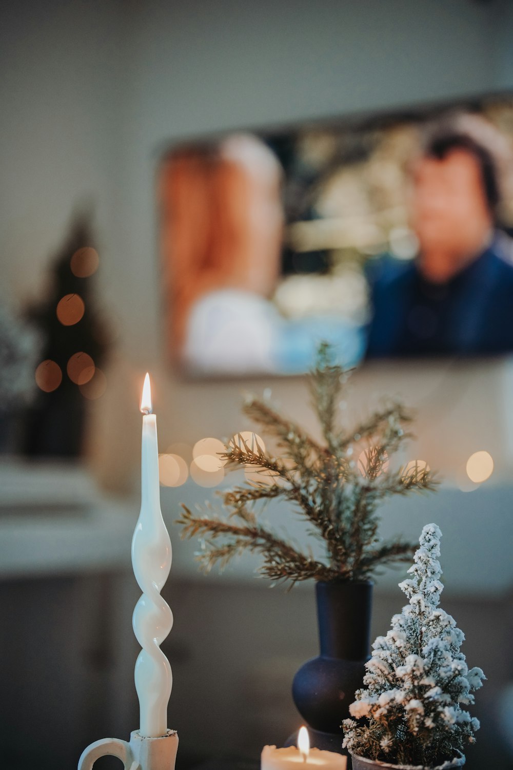 a couple of candles sitting on top of a table