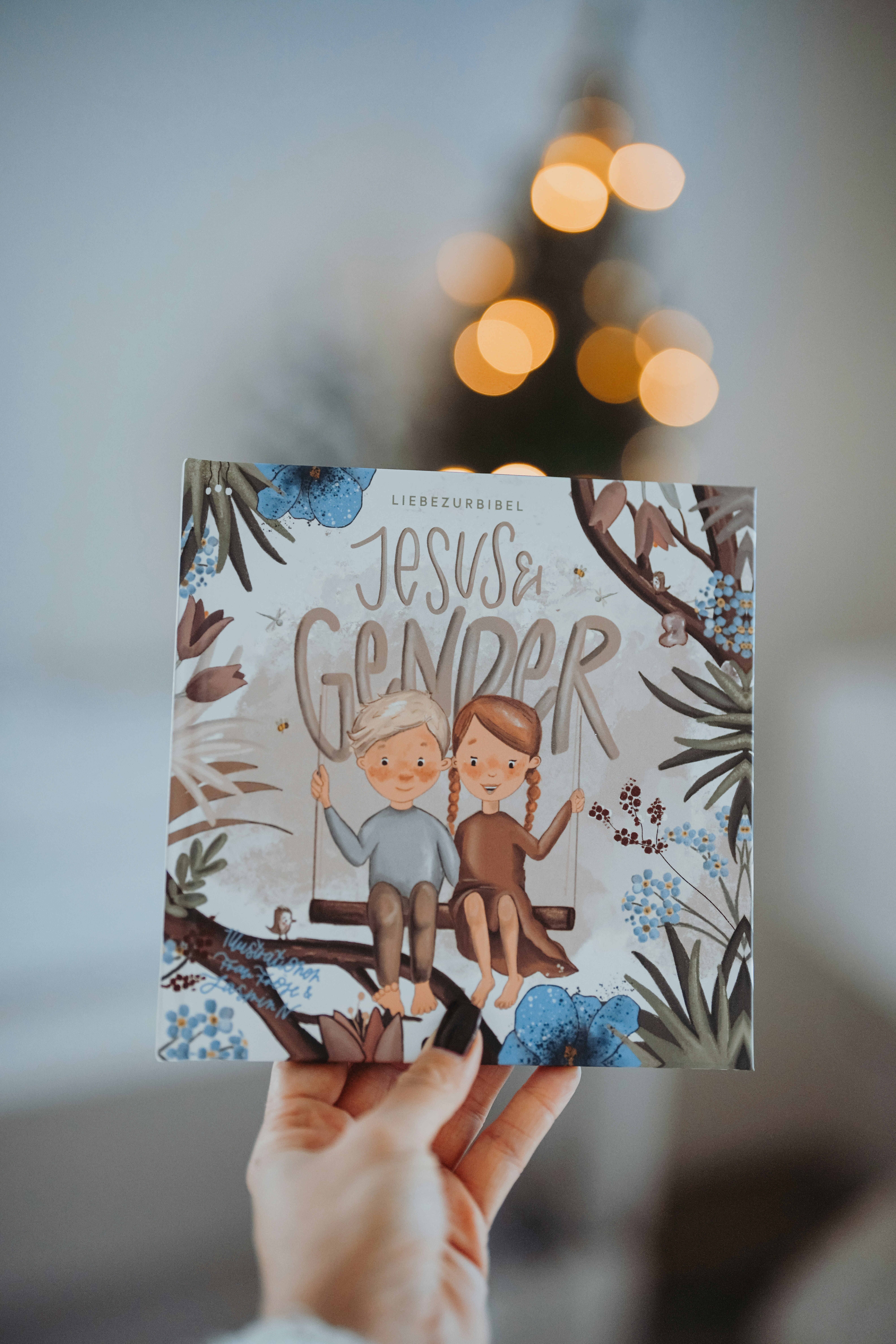 a person holding up a card with a picture of two monkeys on it