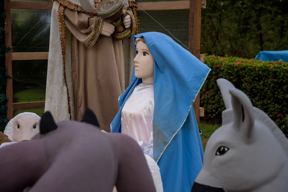 a nativity scene with a statue of mary and baby jesus