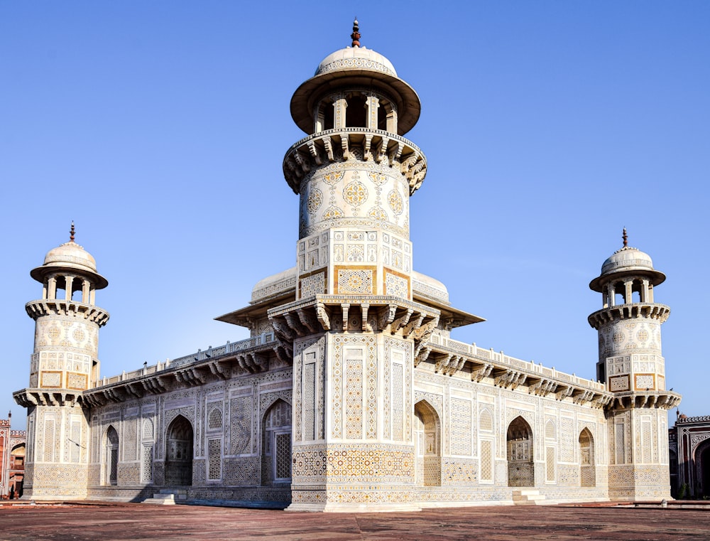 a large white building with two towers on top of it