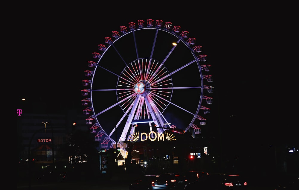 a large ferris wheel lit up at night