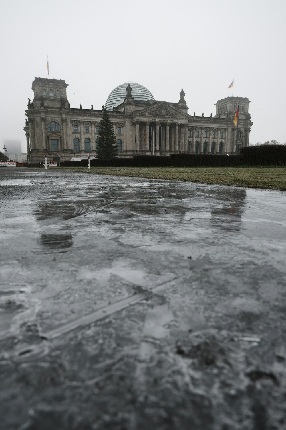 a large building with a lot of ice on the ground