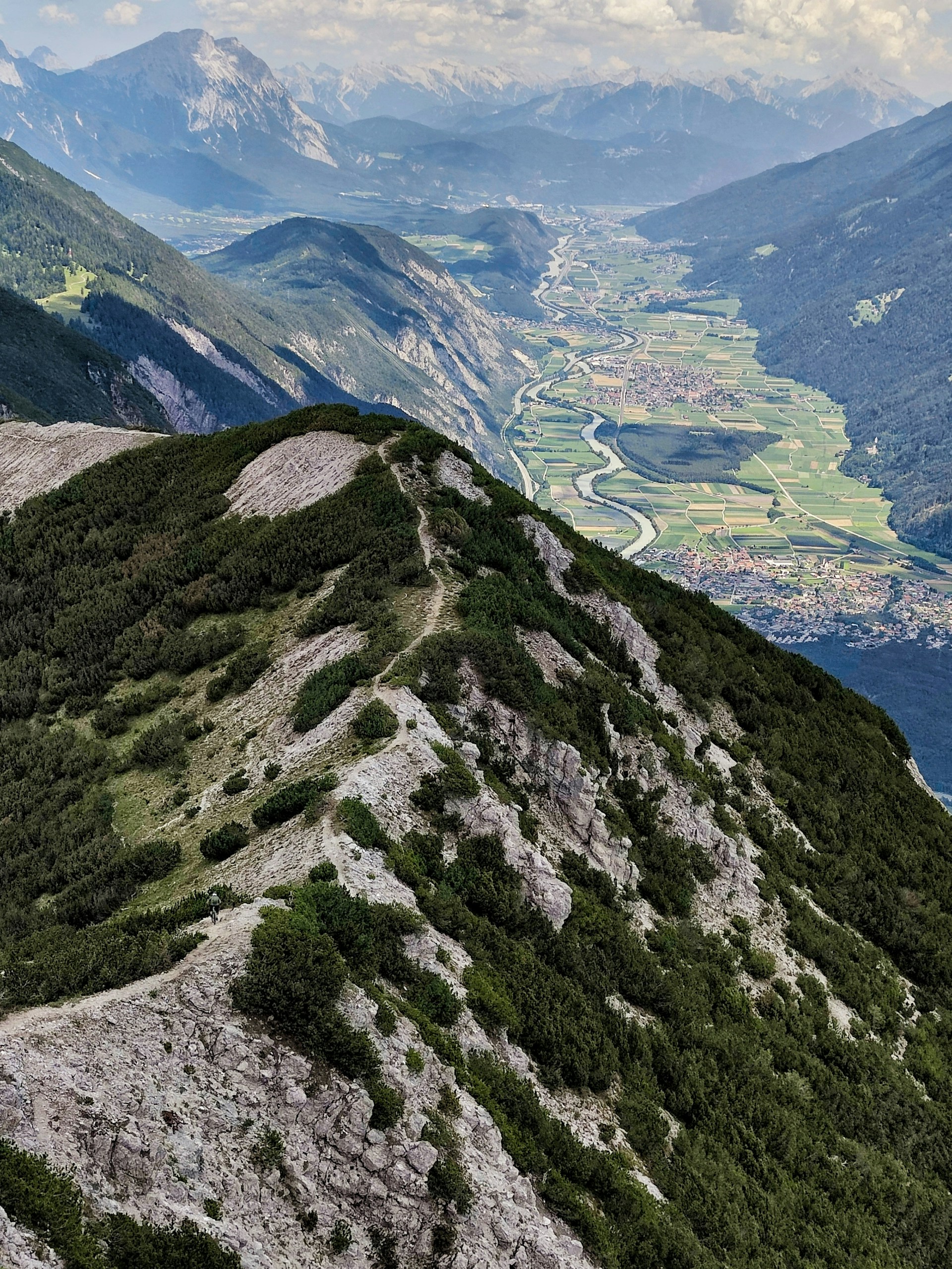 a view of a valley and mountains from a high point of view