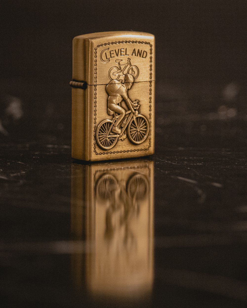 a lighter with a picture of a cyclist on it