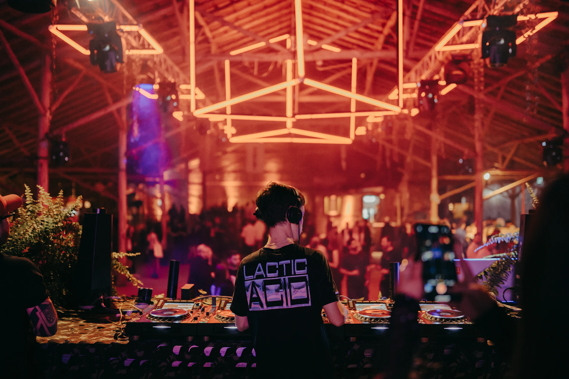 a person standing in front of a dj booth