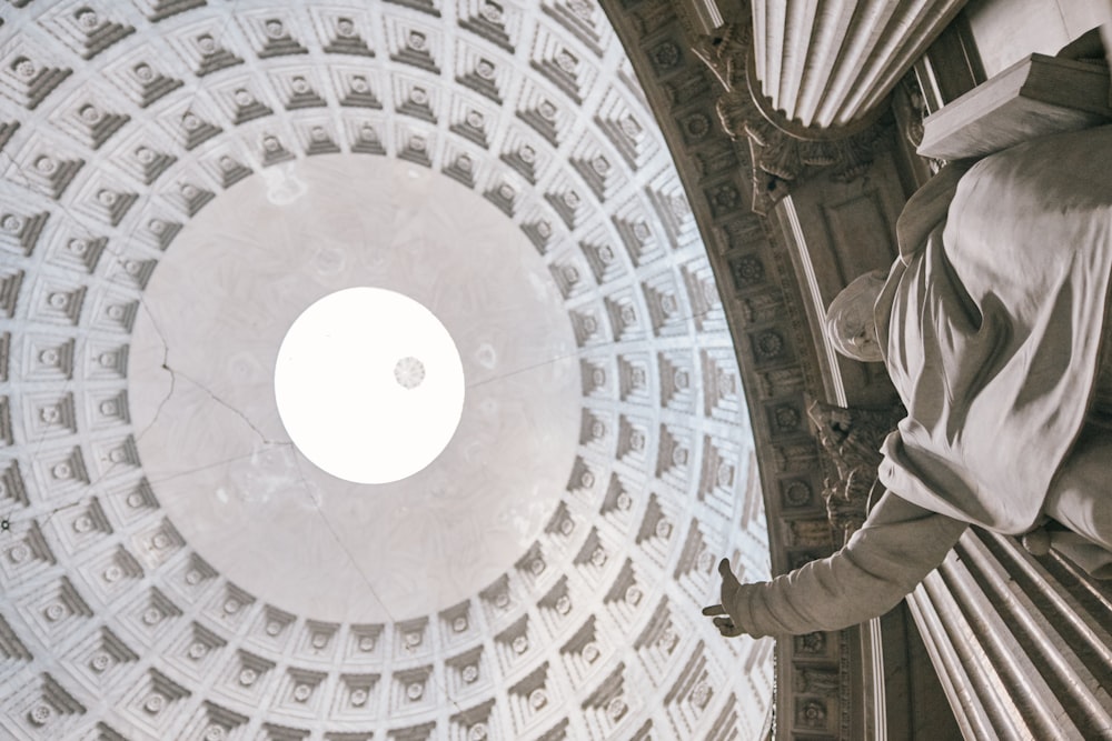 looking up at the ceiling of the dome of a building