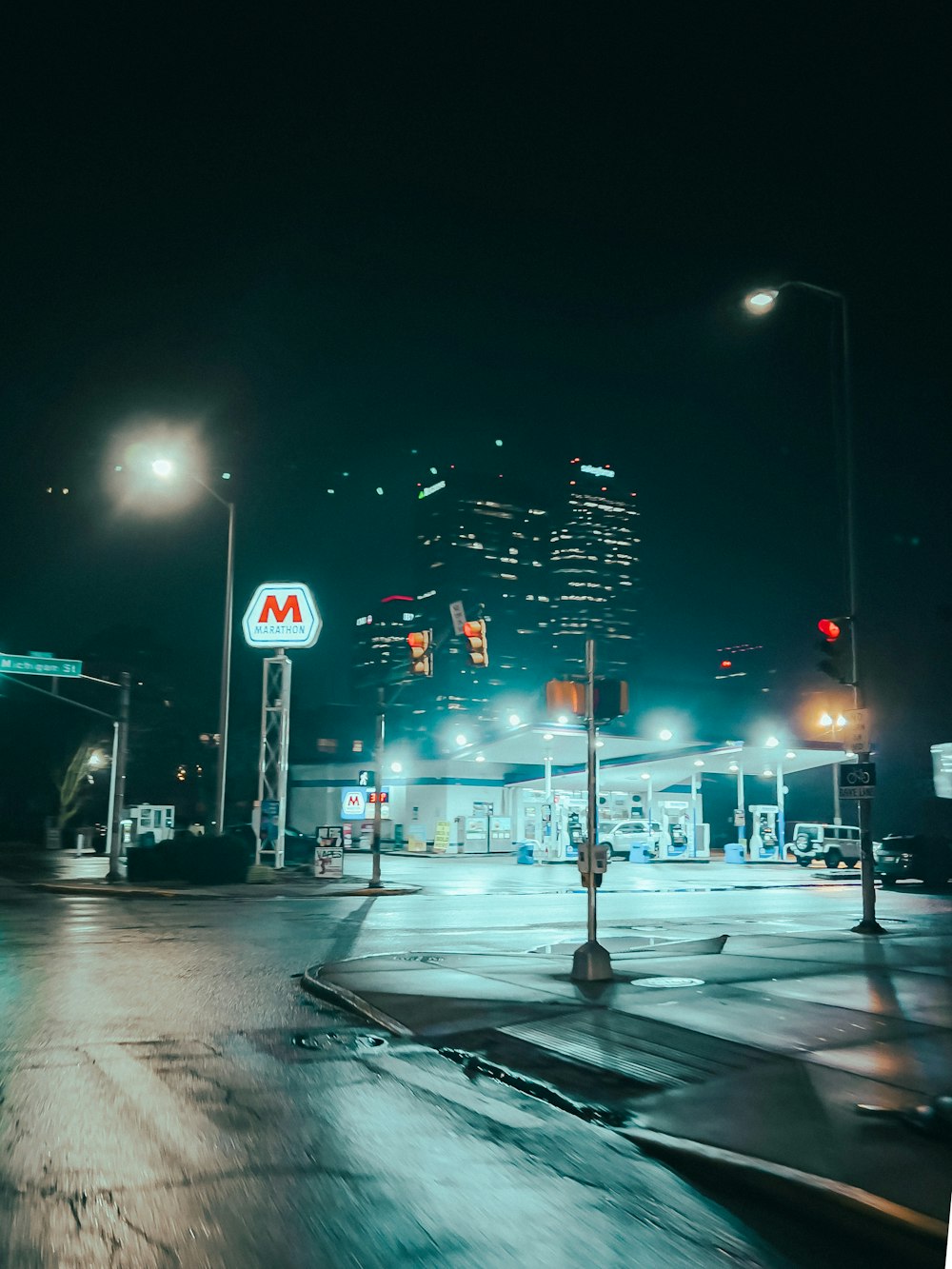 a city street at night with a mcdonald's sign