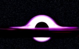An artistic representation of a black hole surrounded by stars.