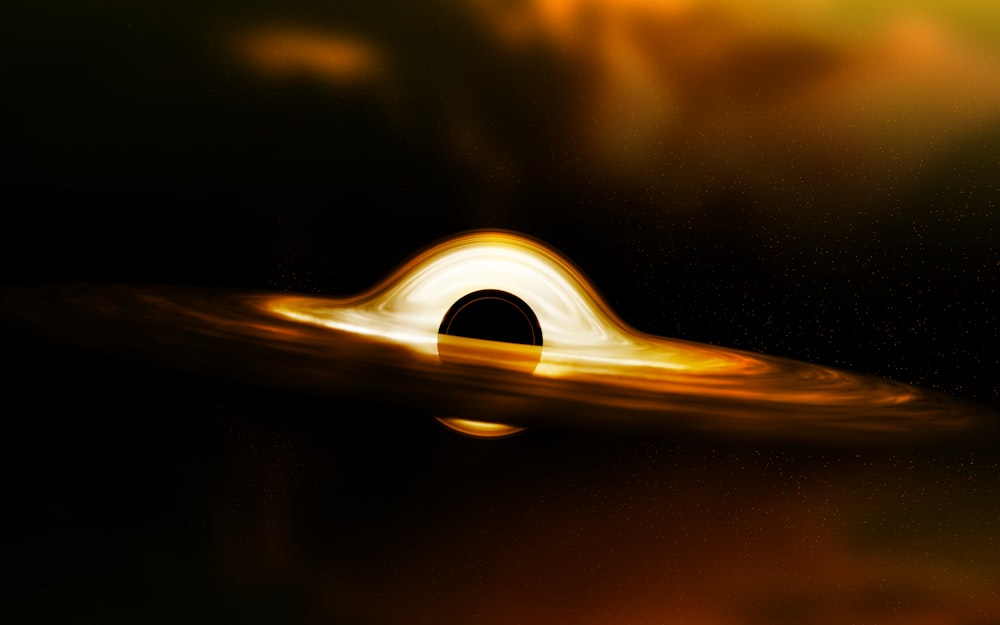 uma imagem de um buraco negro no céu