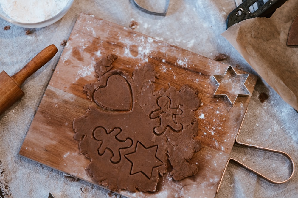 a cutting board with a cookie on it