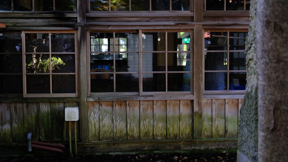 a wooden building with many windows at night