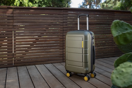 a piece of luggage sitting on top of a wooden deck