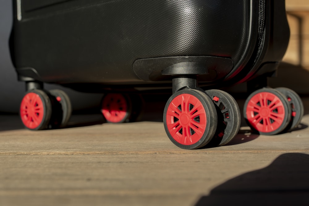 a close up of a suitcase with wheels