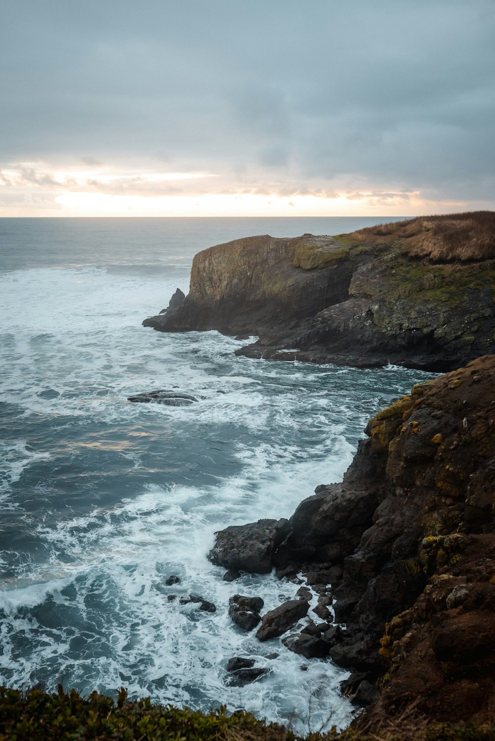 a view of the ocean from a cliff