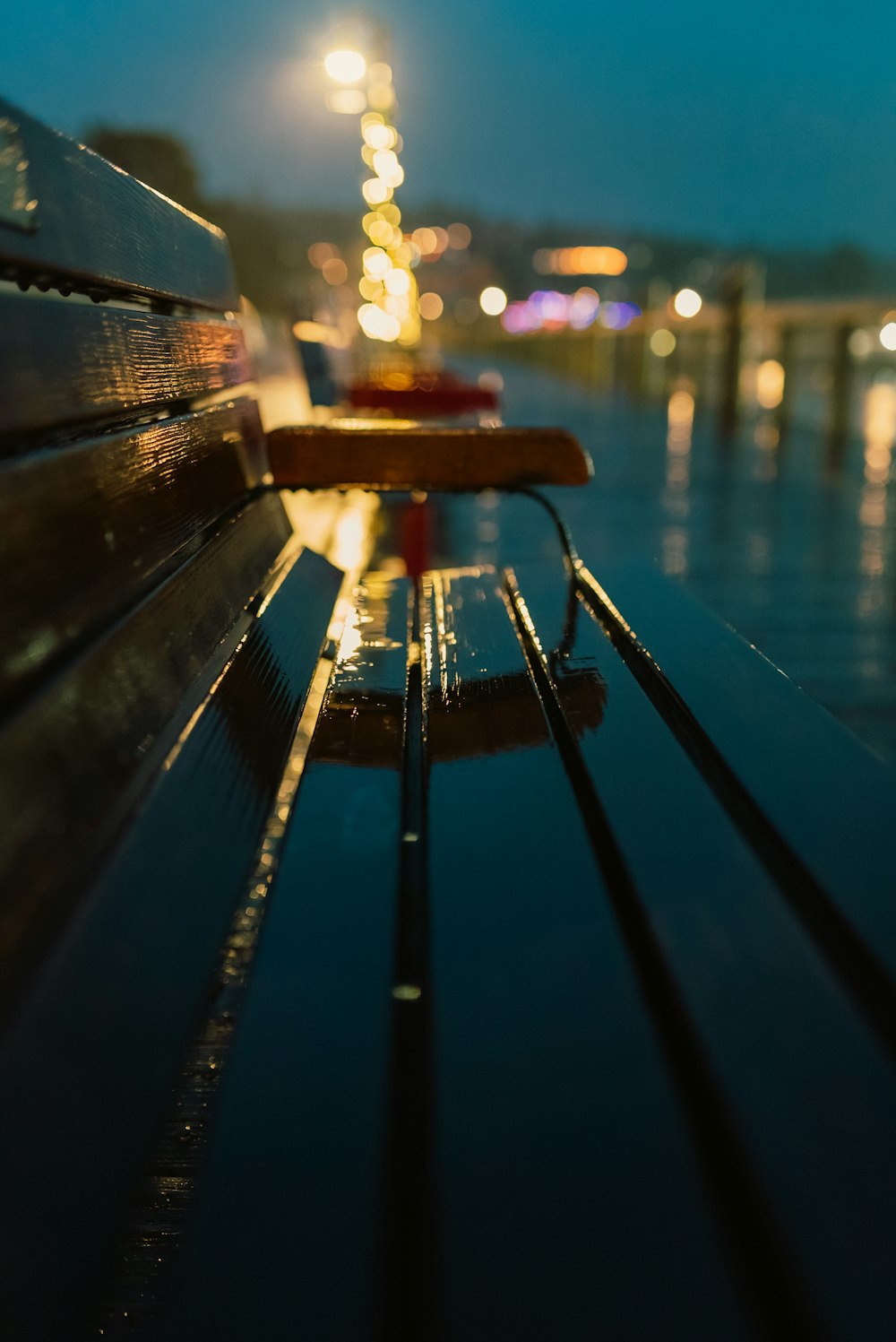 a close up of a bench on a pier