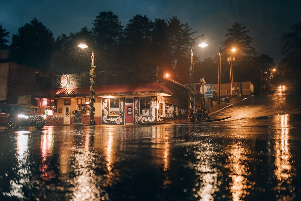 a gas station sitting on the side of a wet road