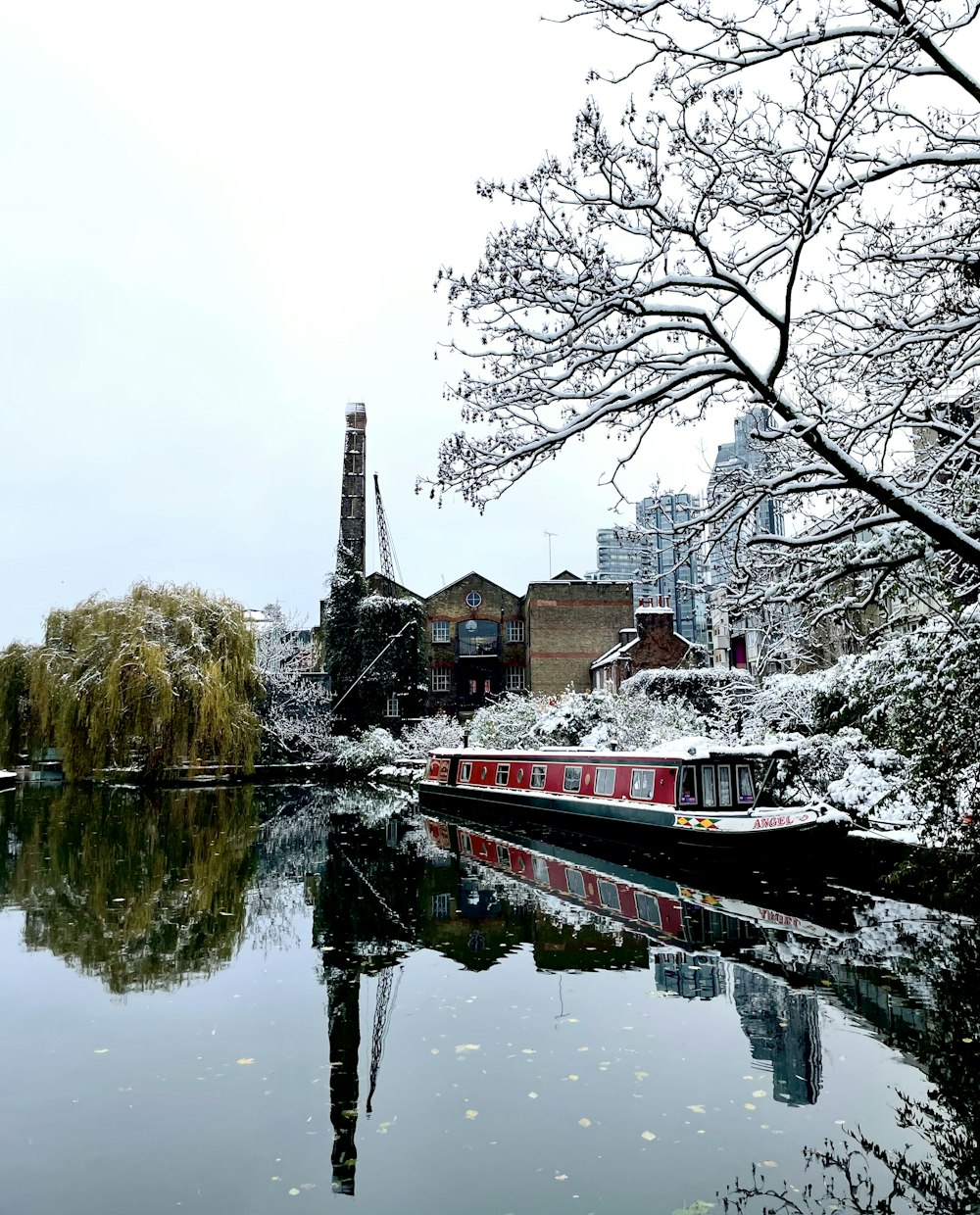 a boat on a river in a city