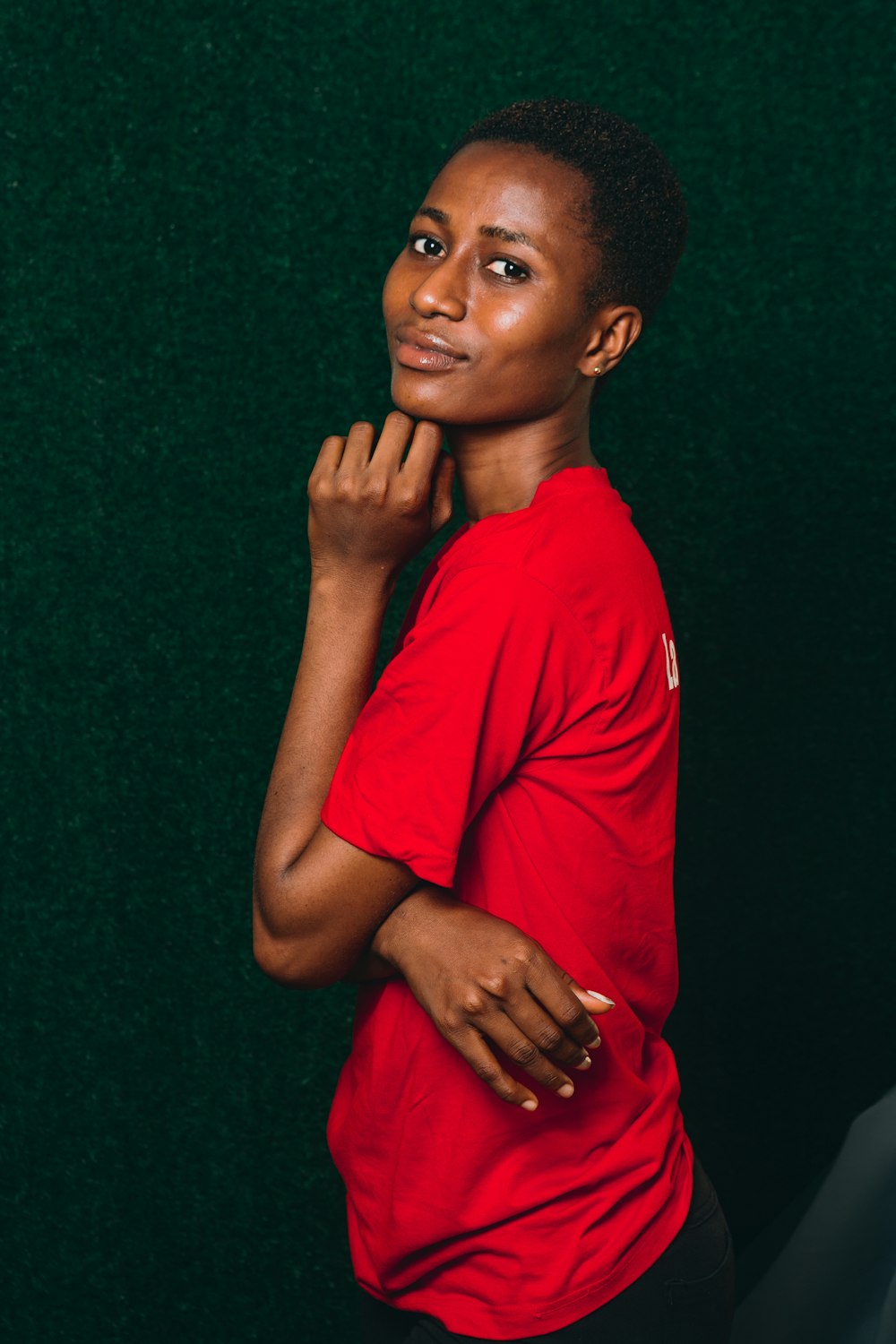 a woman in a red shirt posing for a picture