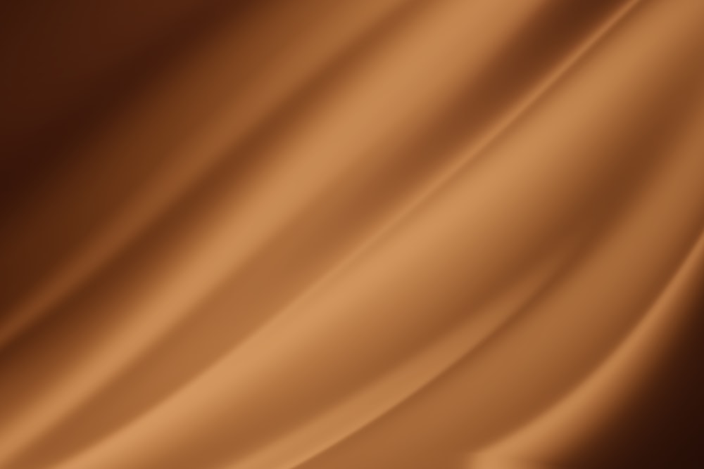 Un primer plano de un fondo marrón satinado
