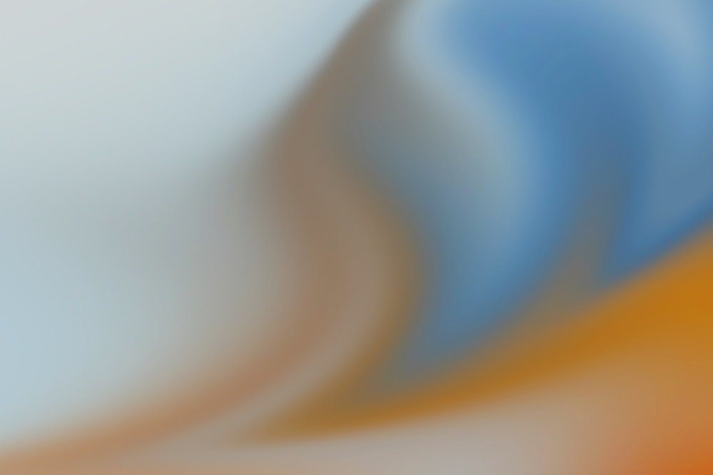 a blurry image of an orange and blue background