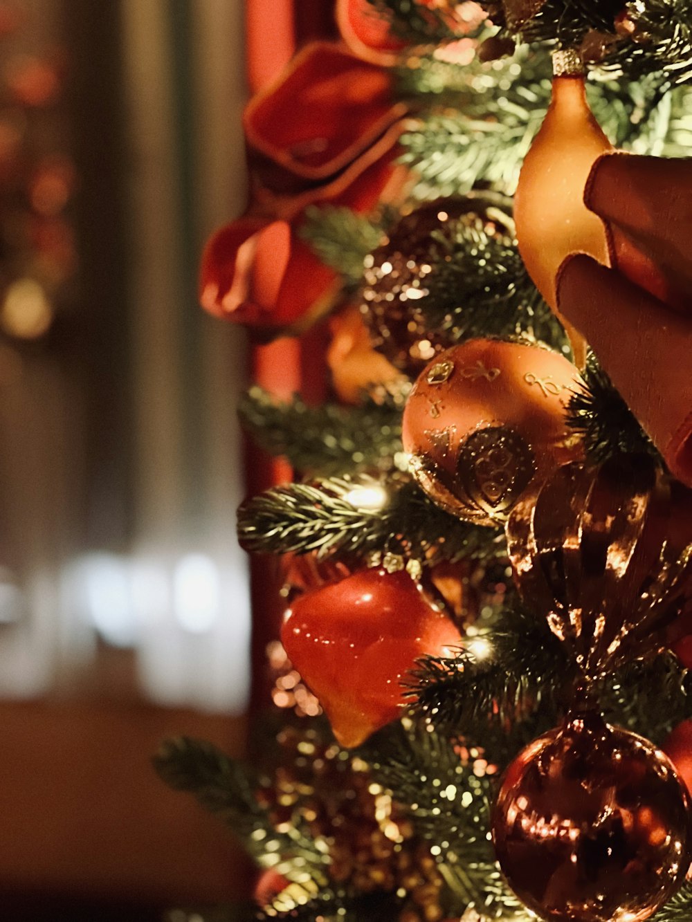 a close up of a christmas tree with ornaments