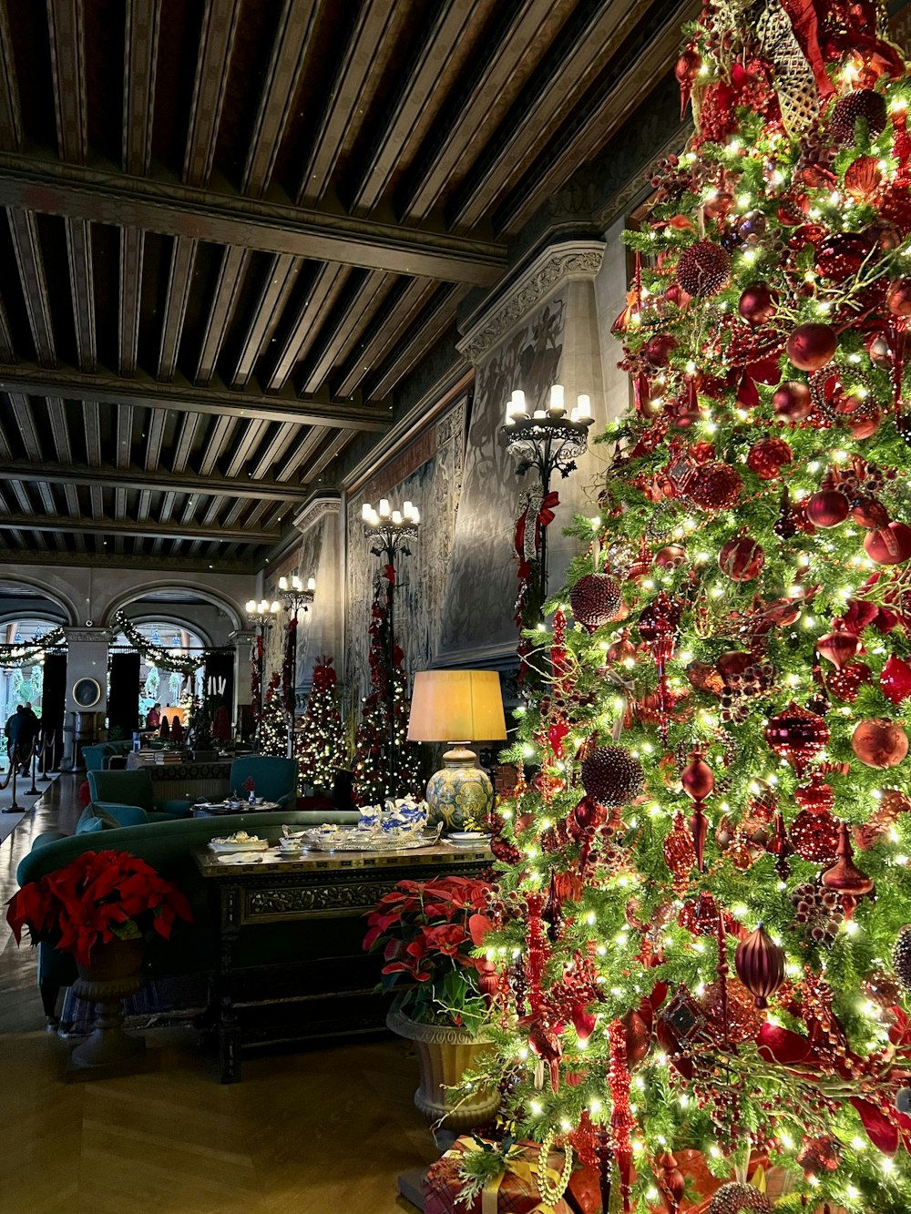 a decorated christmas tree in a large room