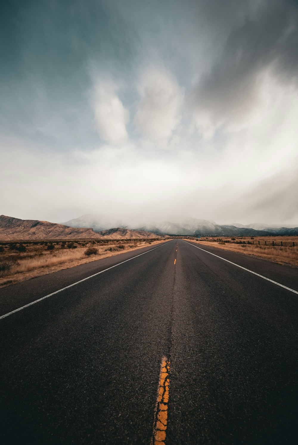 an empty road in the middle of nowhere