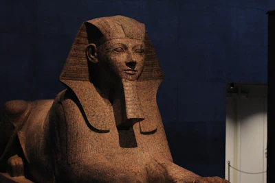 An ancient statue of a seated scribe, its serene expression inviting reflection on Egypt's scholarly past.