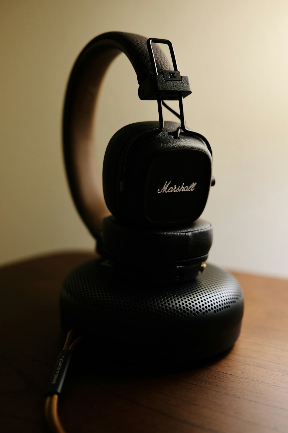 a pair of headphones sitting on top of a wooden table