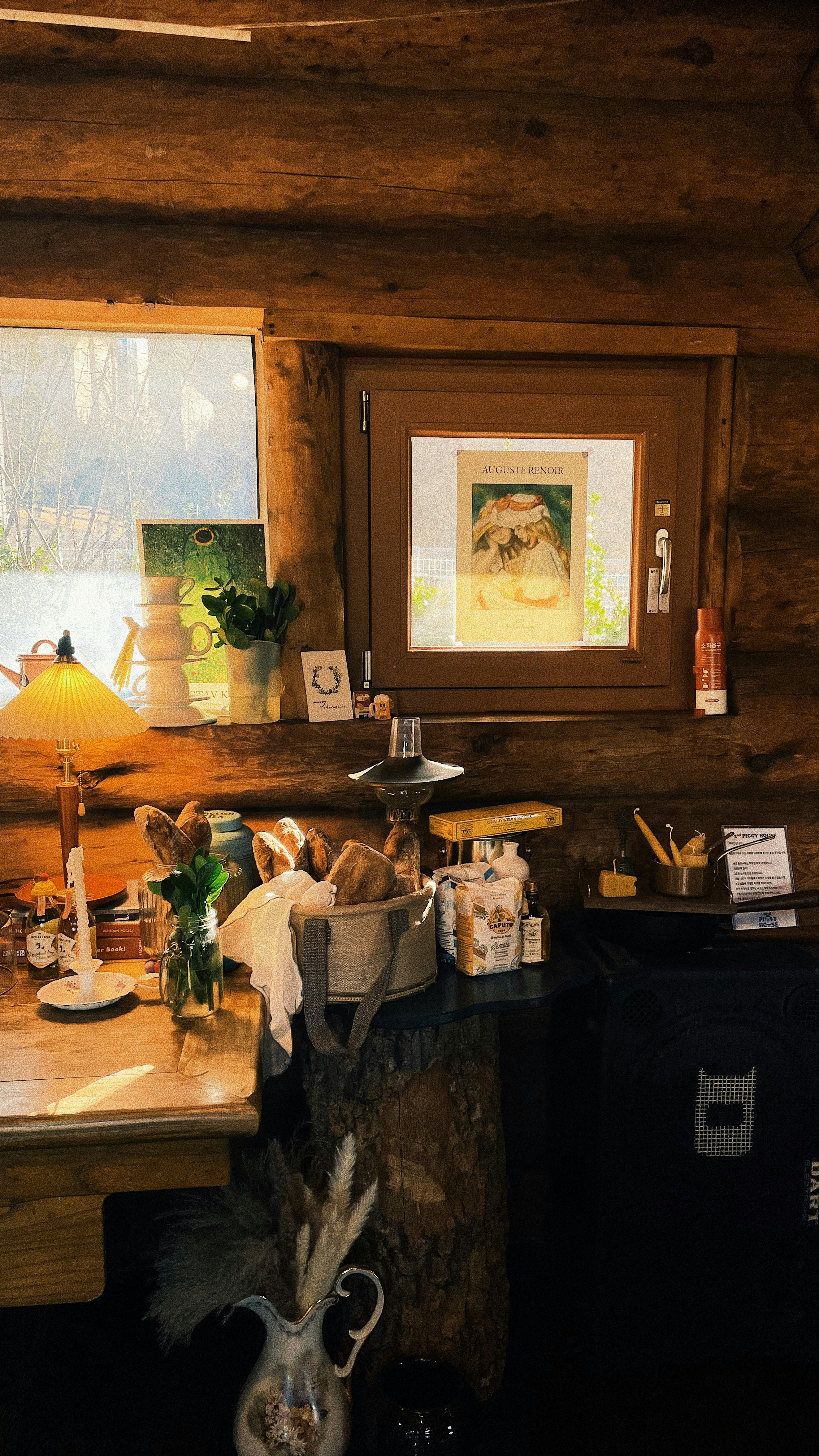 a room with a desk and a deer head