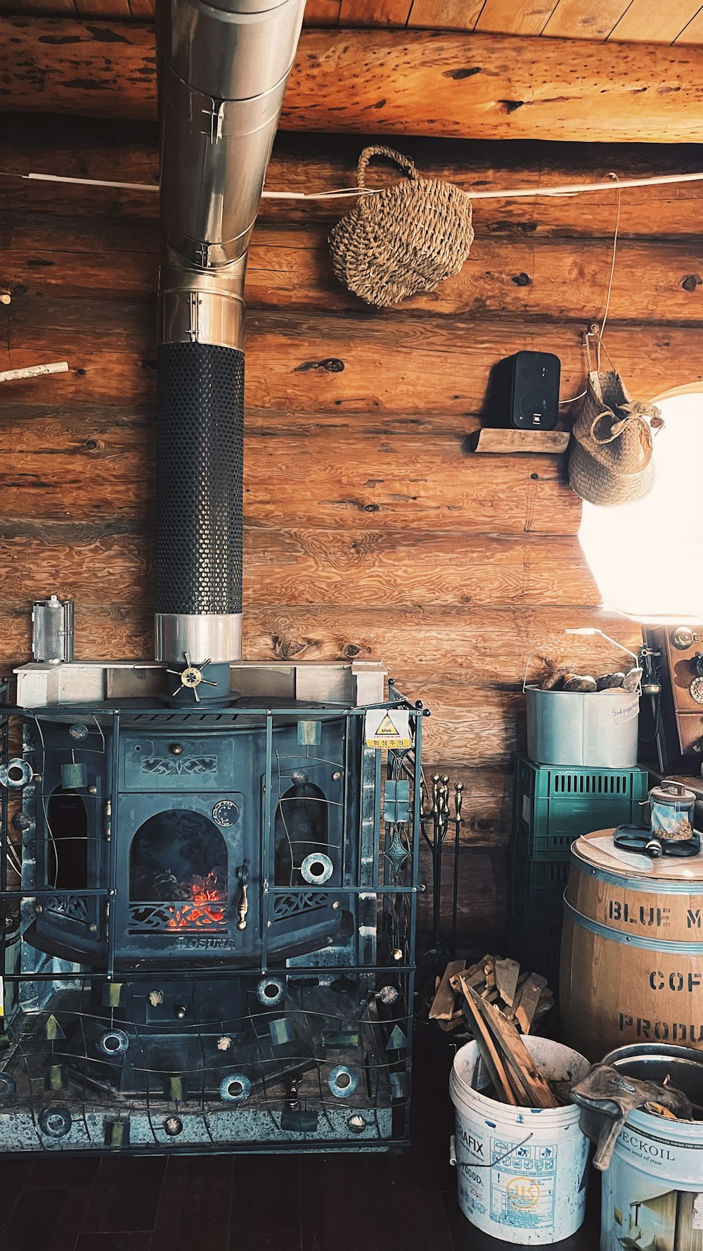 a wood burning stove in a log cabin