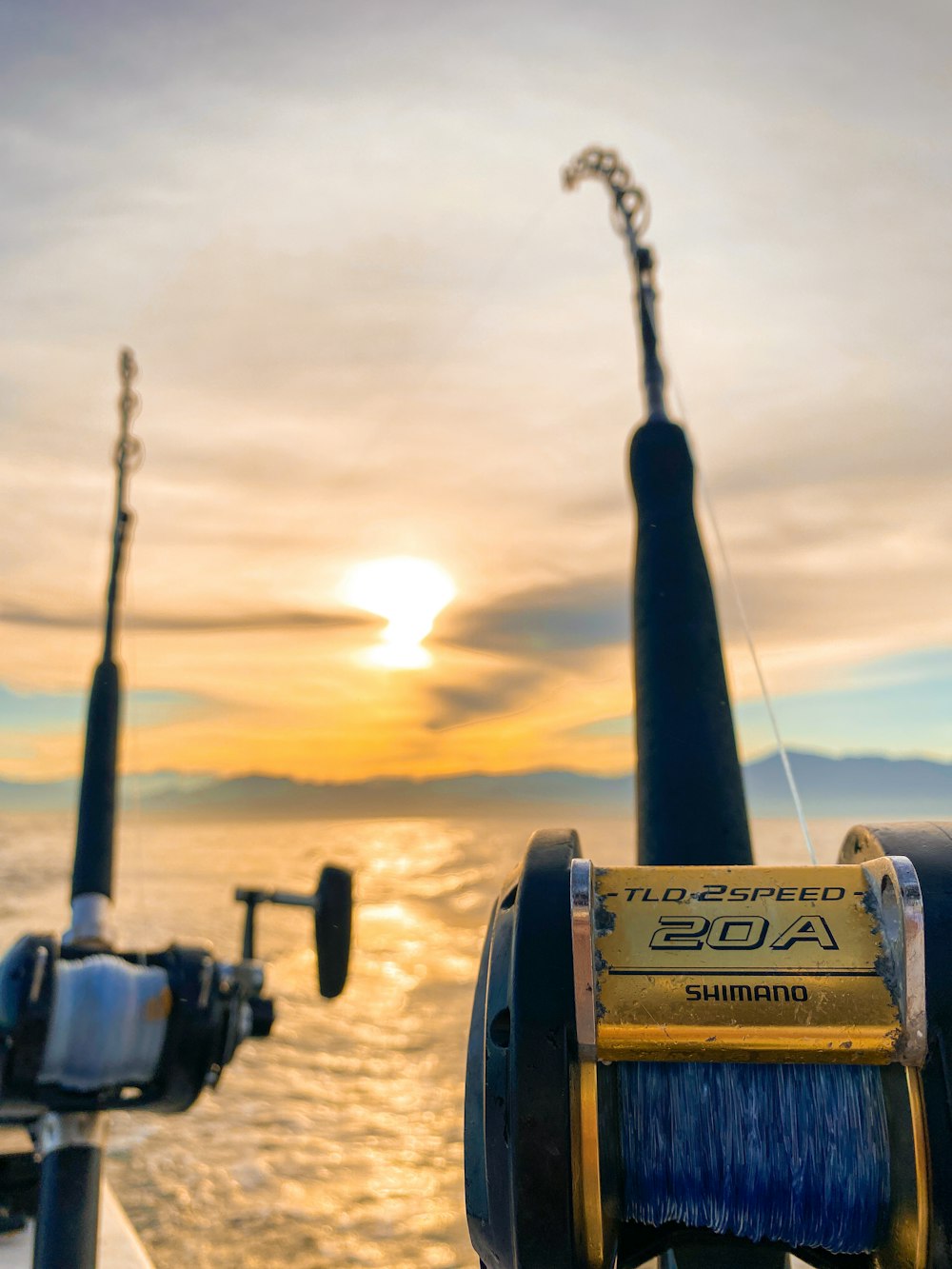 a couple of fishing rods sitting on top of a boat