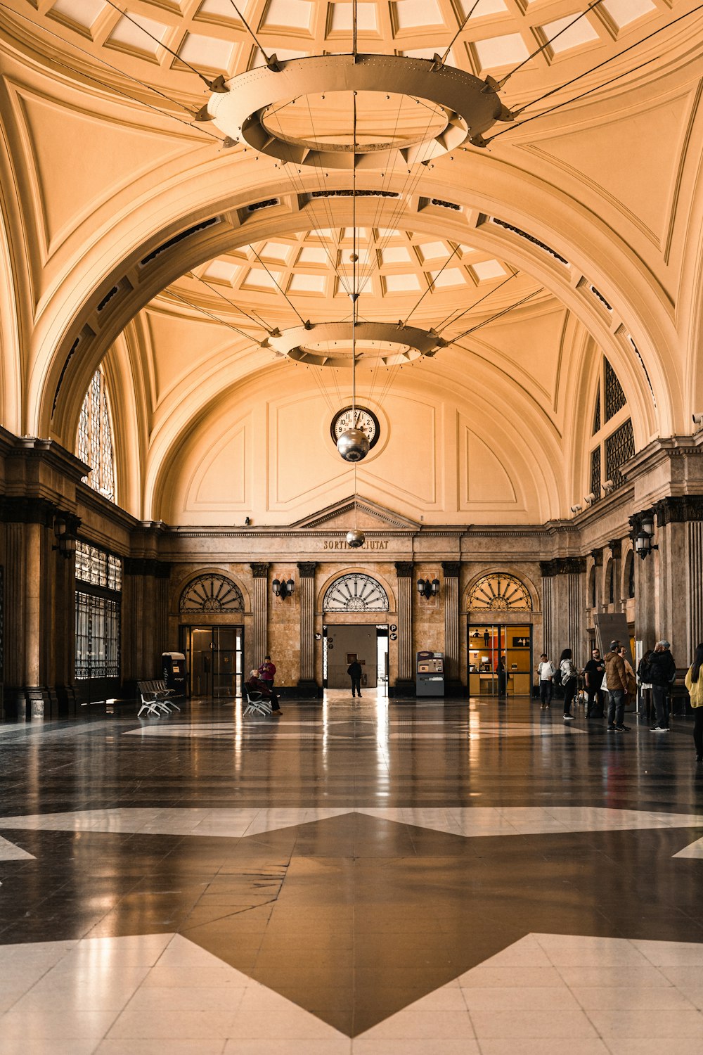 a large building with a clock on the ceiling