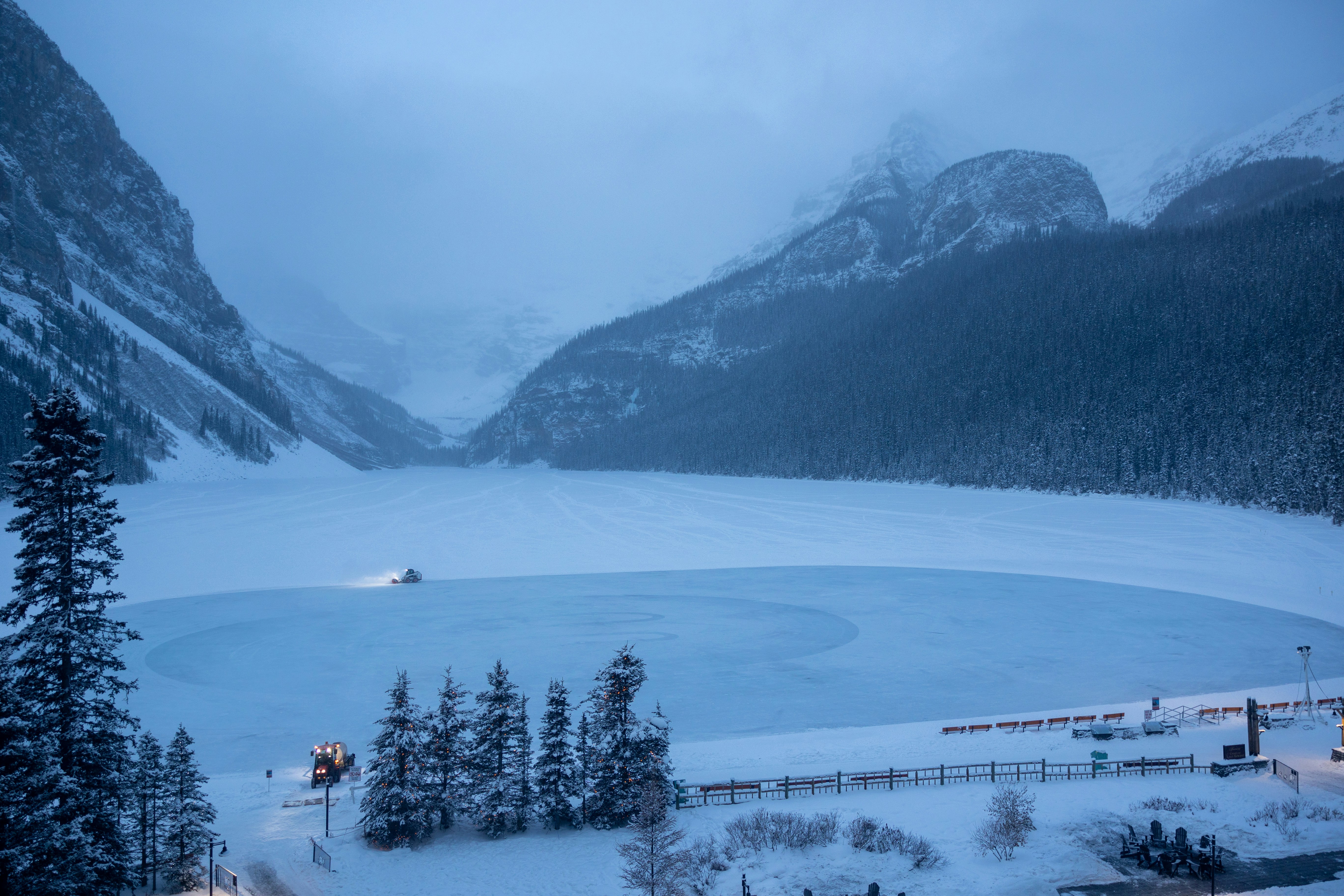A view of a snow covered mountain and a lake photo – Free Lake louise ...