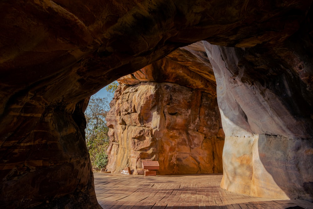 a bench sitting in the middle of a cave