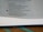 A close-up view of an open book displaying printed text. The page is focused on a section that contains numbered paragraphs, with some text in bold. The book's pages are slightly curved, and a green ribbon marker is visible at the bottom.