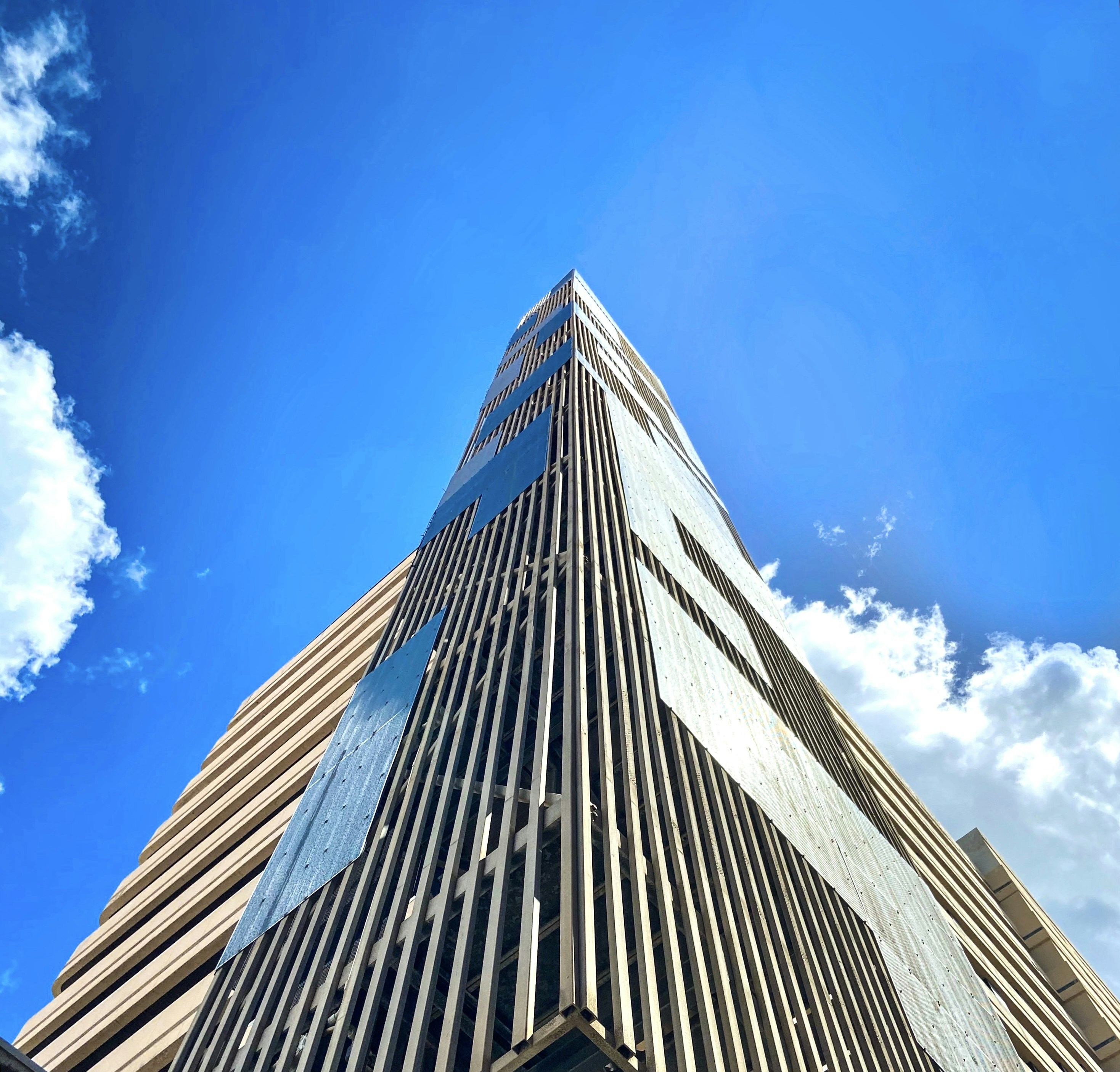 A tall building with a clock on the side of it photo Free Las palmas